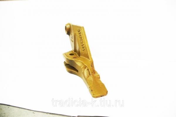 Зубья,   коронки,   протекторы,   адаптеры к ковшам экскаваторов и стойкам рыхлителей бульдозеров